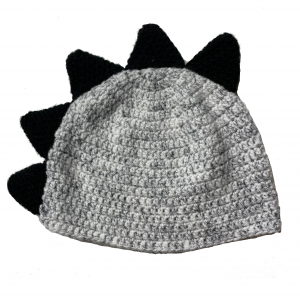 Handmade crocheted dinosaur hat for 3 - 10 year old. Made to an original design by Lisa.