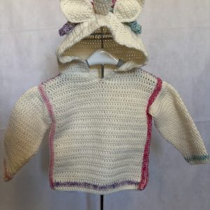 Handmade crocheted unicorn hoodie for 6 - 12 months old. Made to an original design by Lisa.