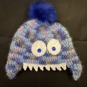 Handmade crocheted monster hat for 3 - 6 months. Made to an original design by Lisa.