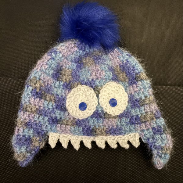 Handmade crocheted monster hat for 3 - 6 months. Made to an original design by Lisa.