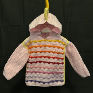 Handmade crocheted dinosaur hoodie for 1 - 2 years old. Made to an original design by Lisa.