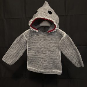Handmade crocheted shark hoodie for 1 - 2 years old. Made to an original design by Lisa.